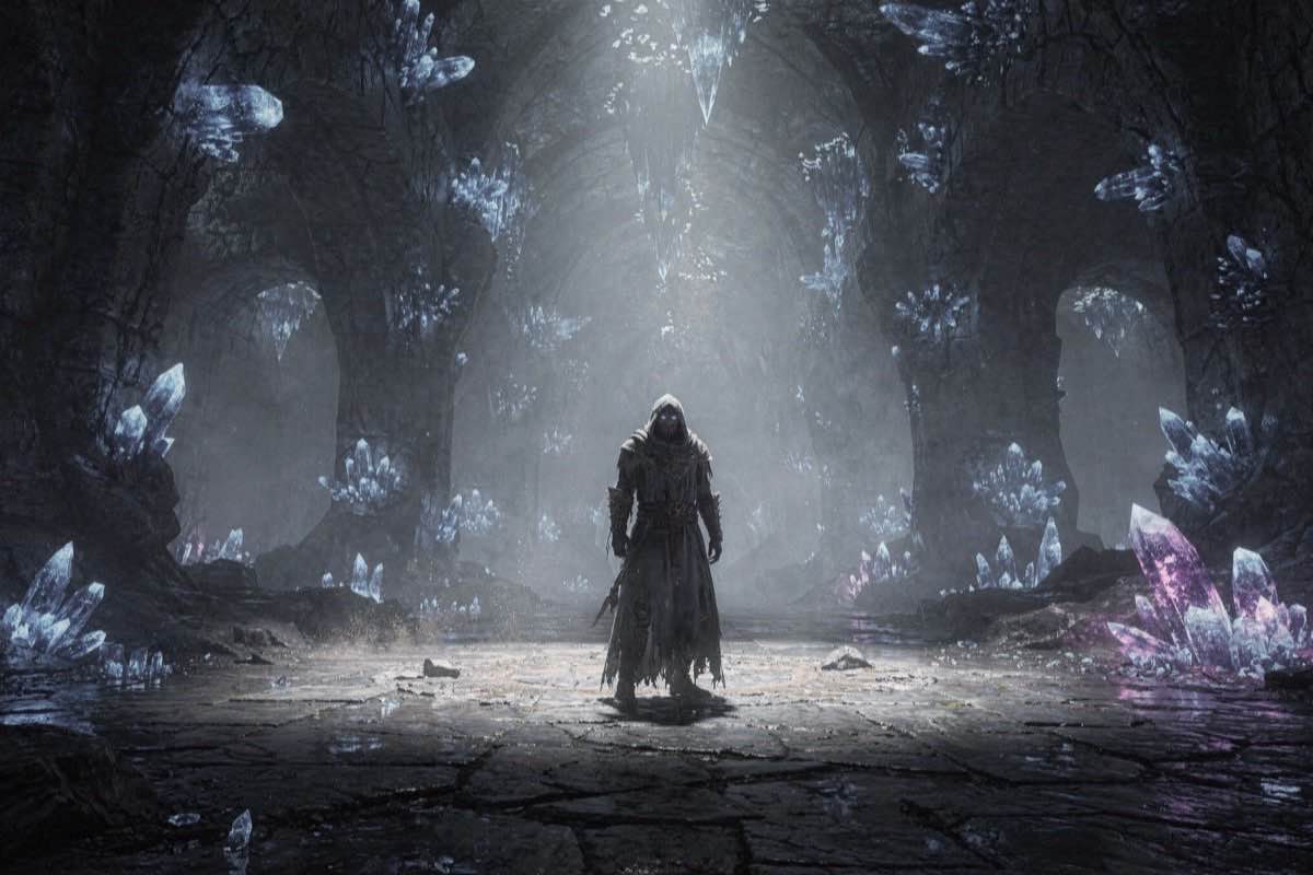 A vast underground chamber lit by blue crystals with a hooded figure